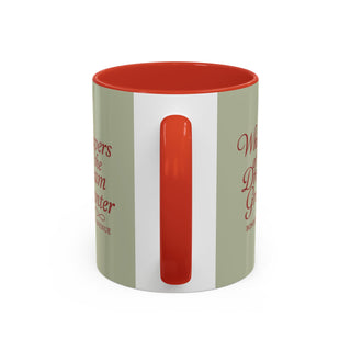 Mug with red interior, handle, and text on a white background
